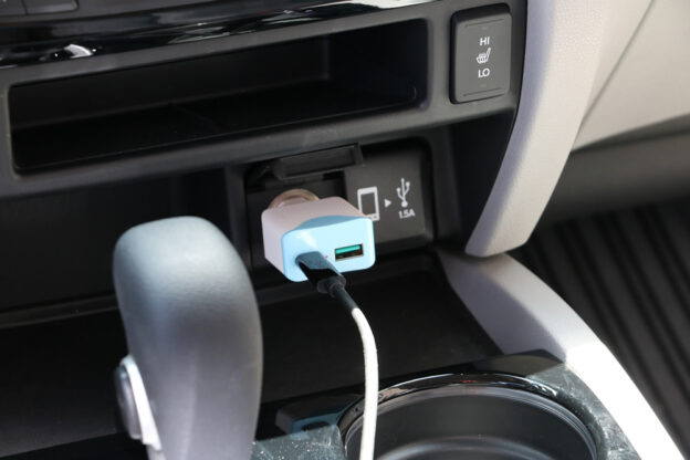 Plugged into power source in the car for charging